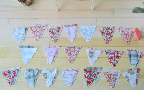 May Day Bunting -- Lucas made a LOT of triangles!